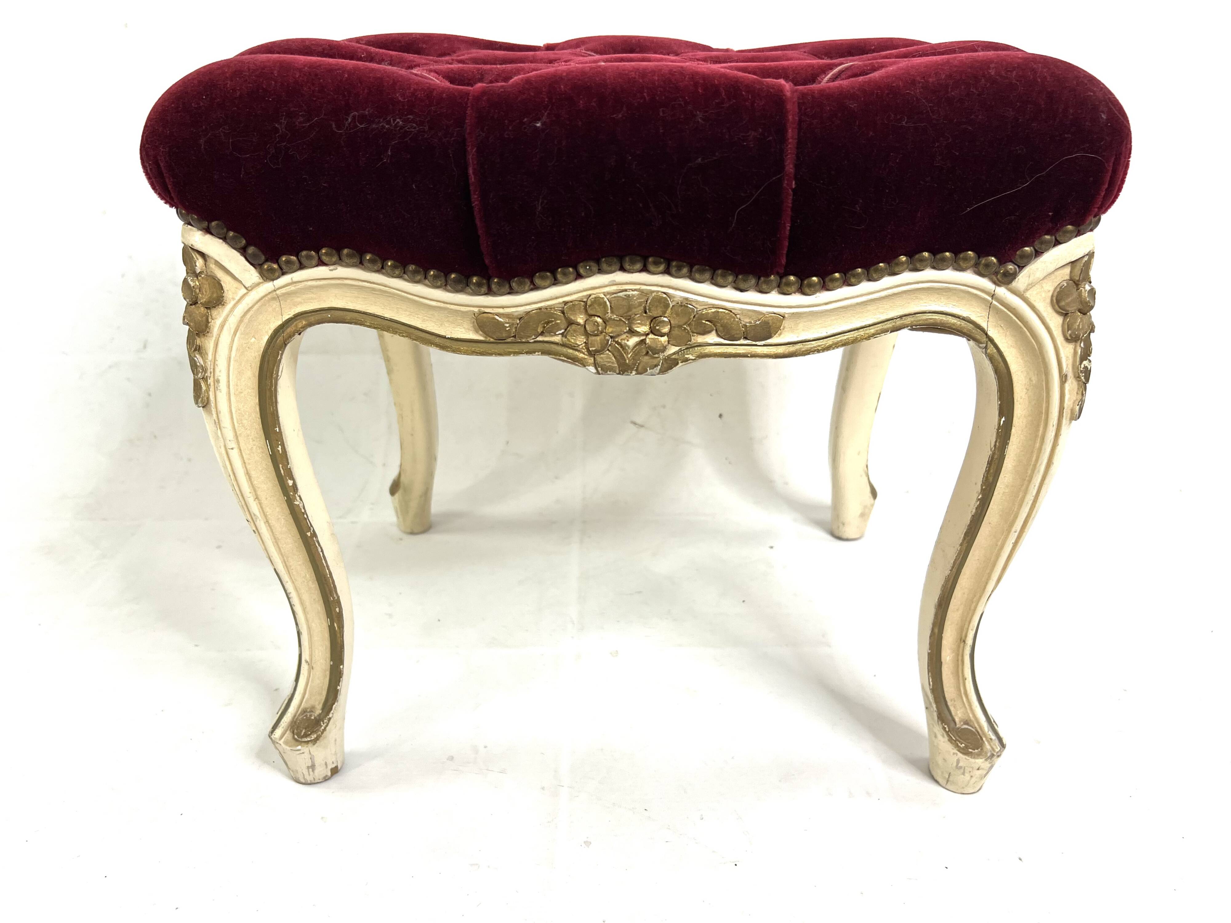 Antique upholstered stool in red velvet and carved wood