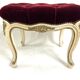 Antique upholstered stool in red velvet and carved wood