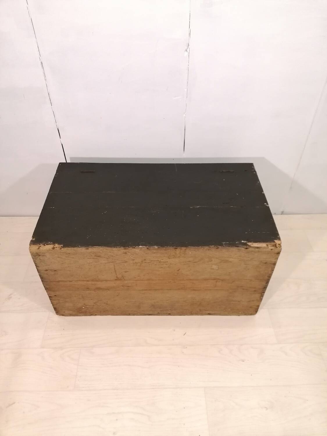 Large travel trunk in blackened wood