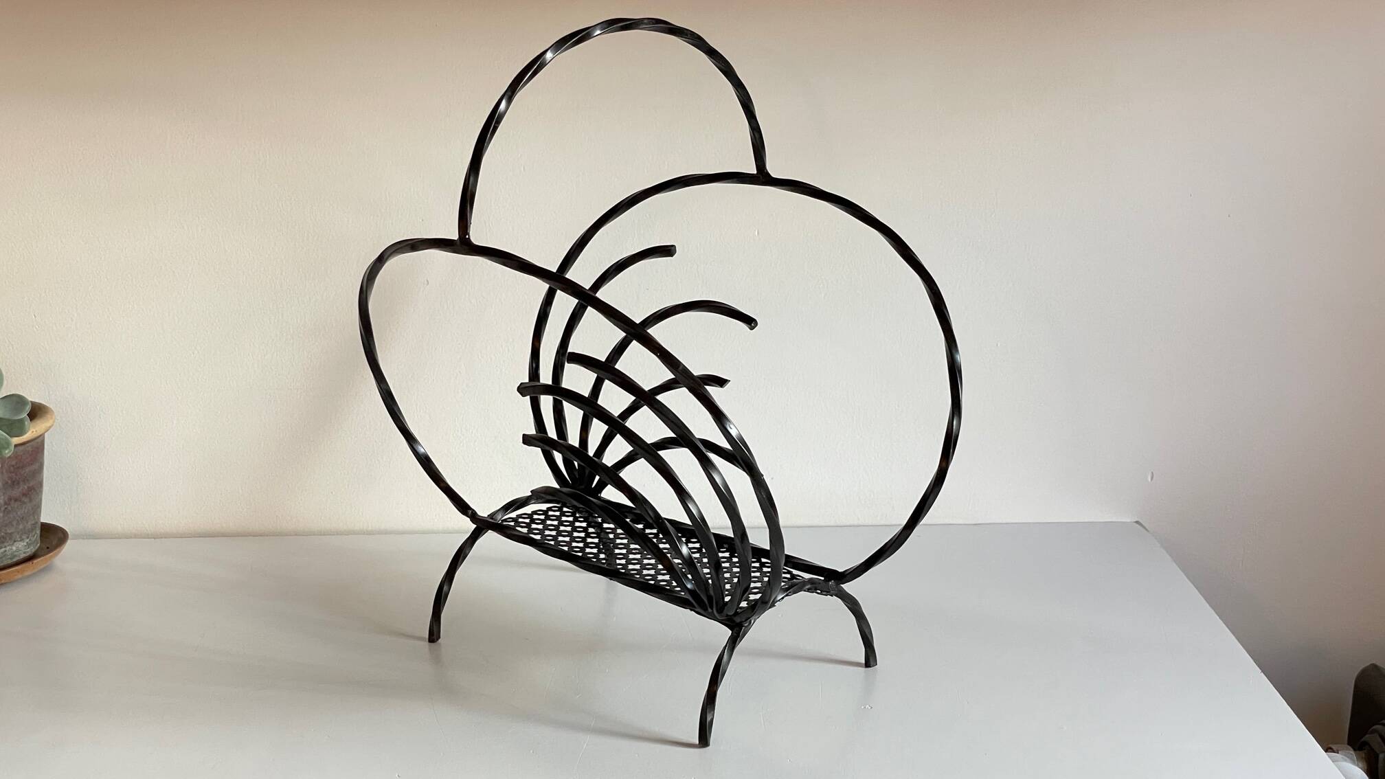 Vintage steel and rigitulle magazine holder