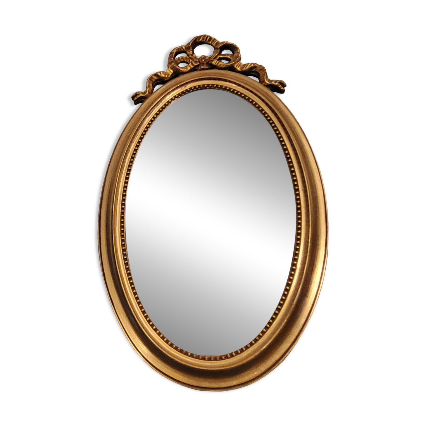 Oval mirror with golden wooden knot