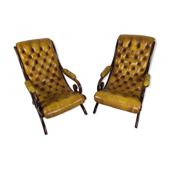 Pair of padded Chesterfield armchairs