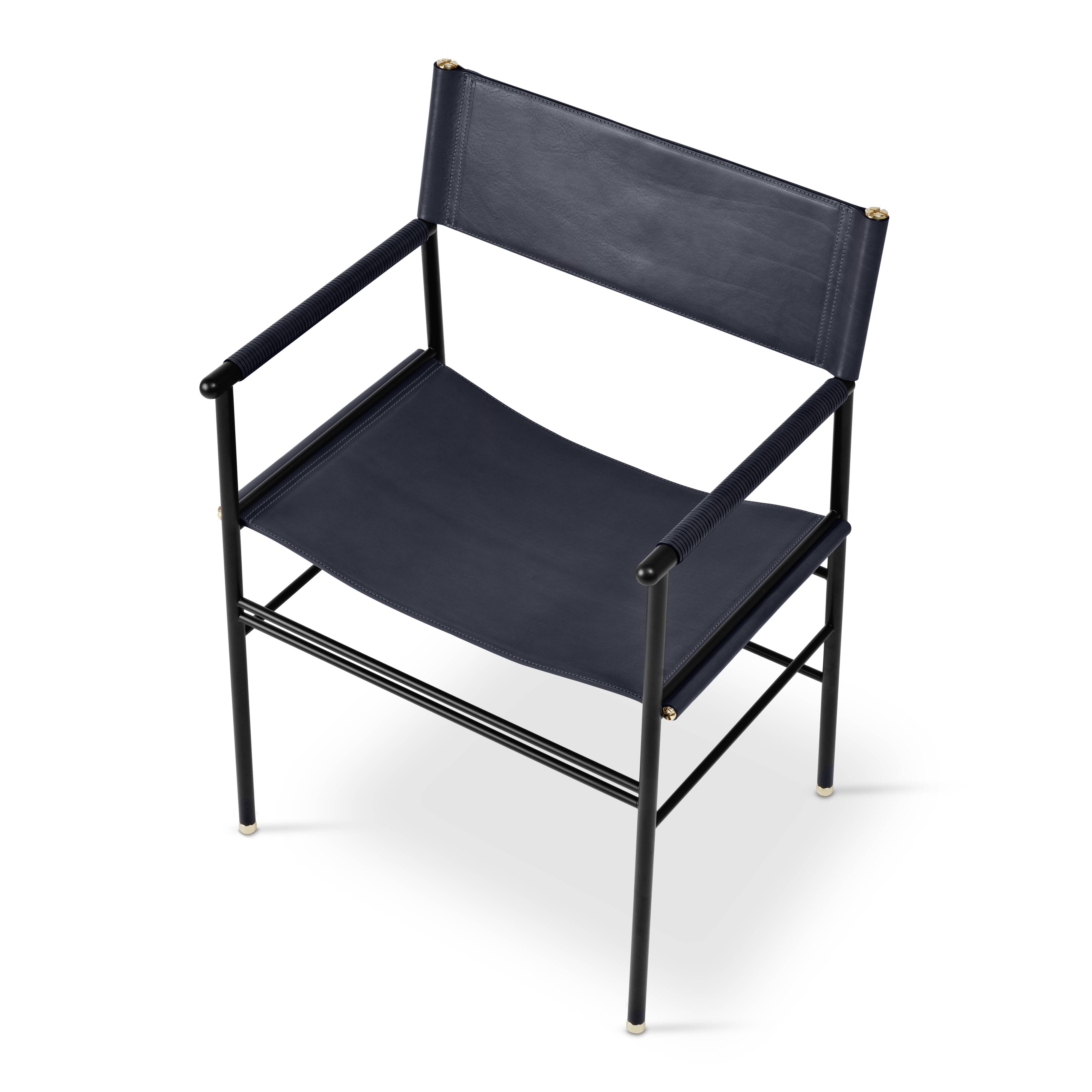 A pair of bar stools with a navy blue leather backrest and black rubber.