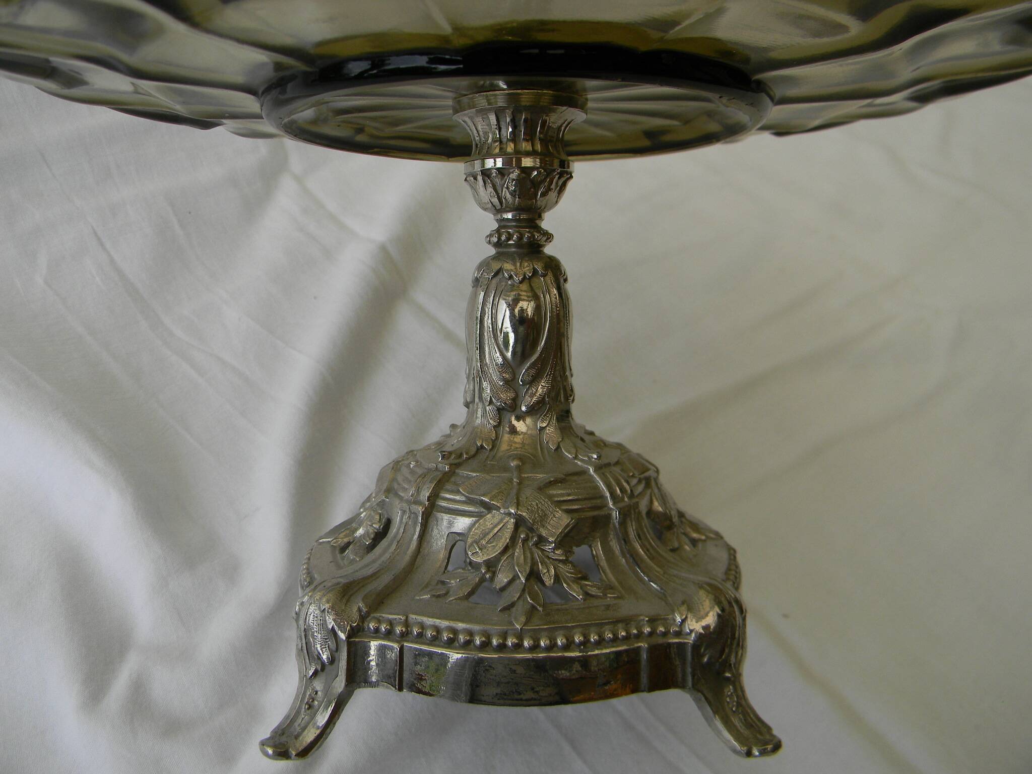 Large smoked glass fruit bowl with a metal base.