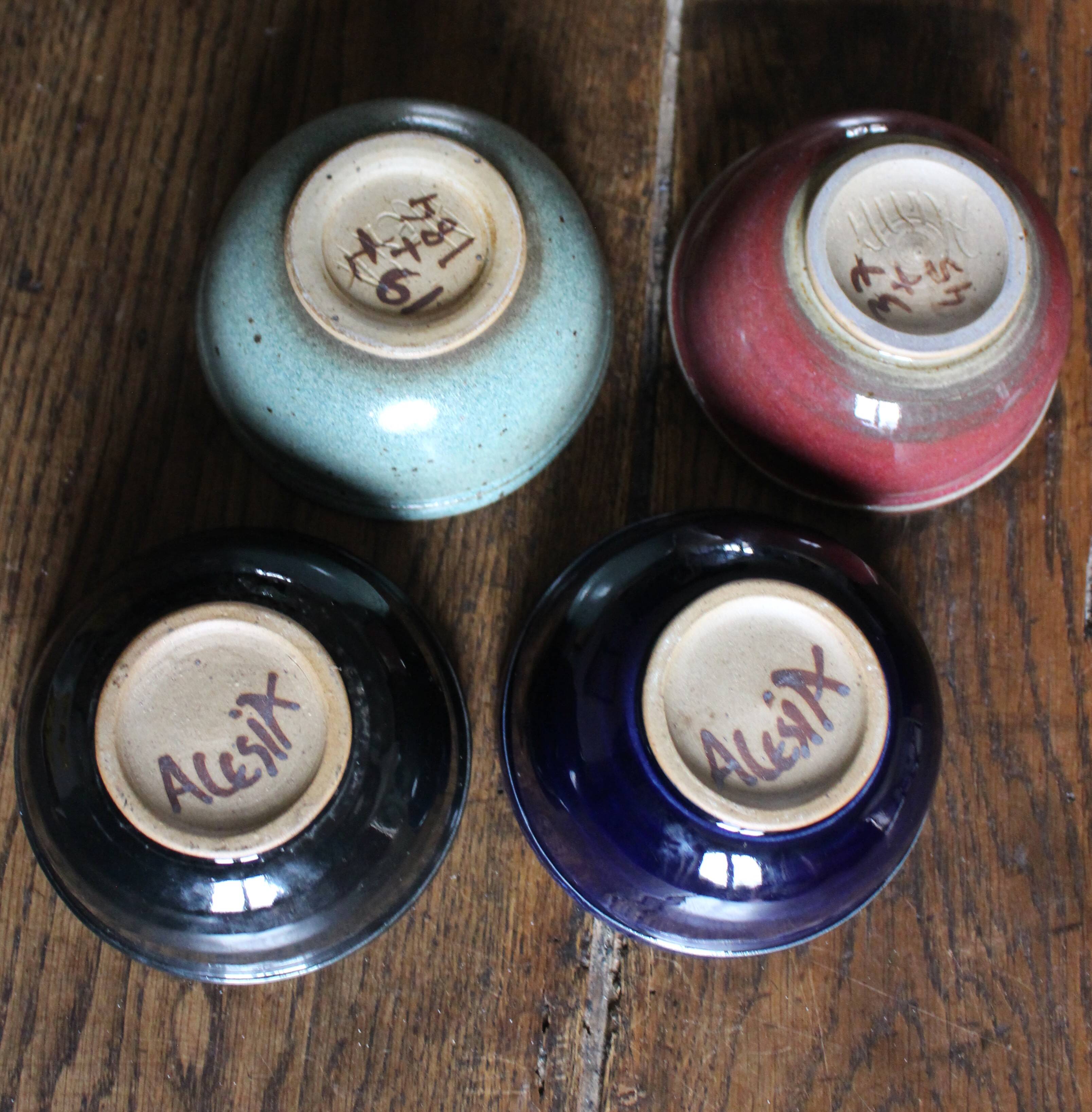 A set of 4 pottery bowls in coloured glaze.