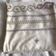 Grey silk nape and towels embroidered with coloured cashmere patterns