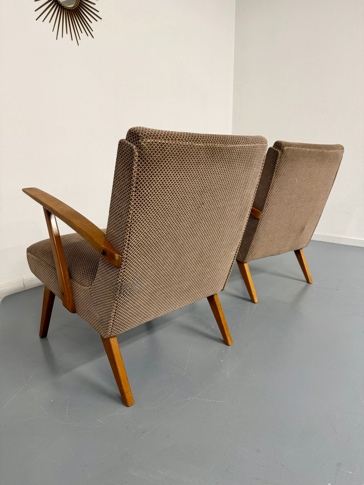 Set of 2 vintage wooden and fabric armchairs designed in the 1960s.