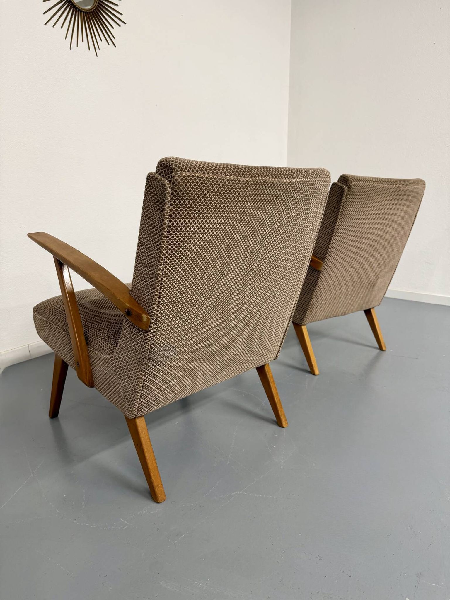Set of 2 vintage wooden and fabric armchairs designed in the 1960s.