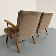 Set of 2 vintage wooden and fabric armchairs designed in the 1960s.