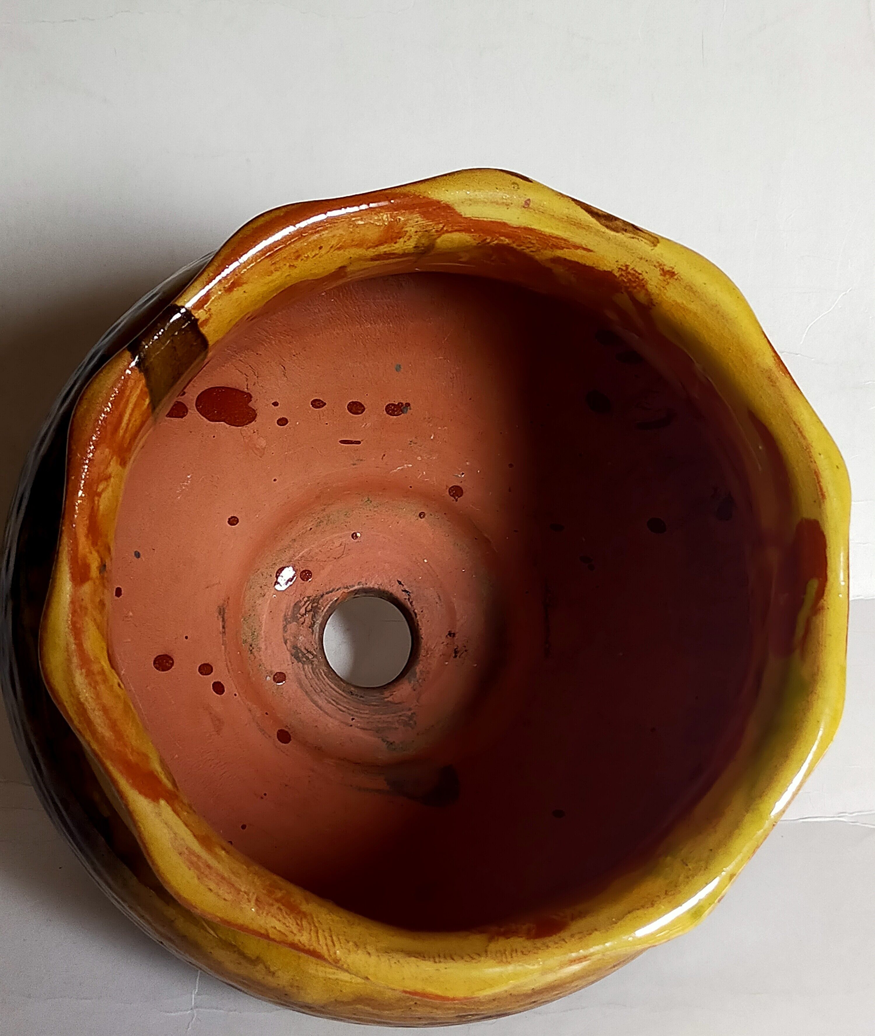 Old provencal pot cover in glazed terracotta