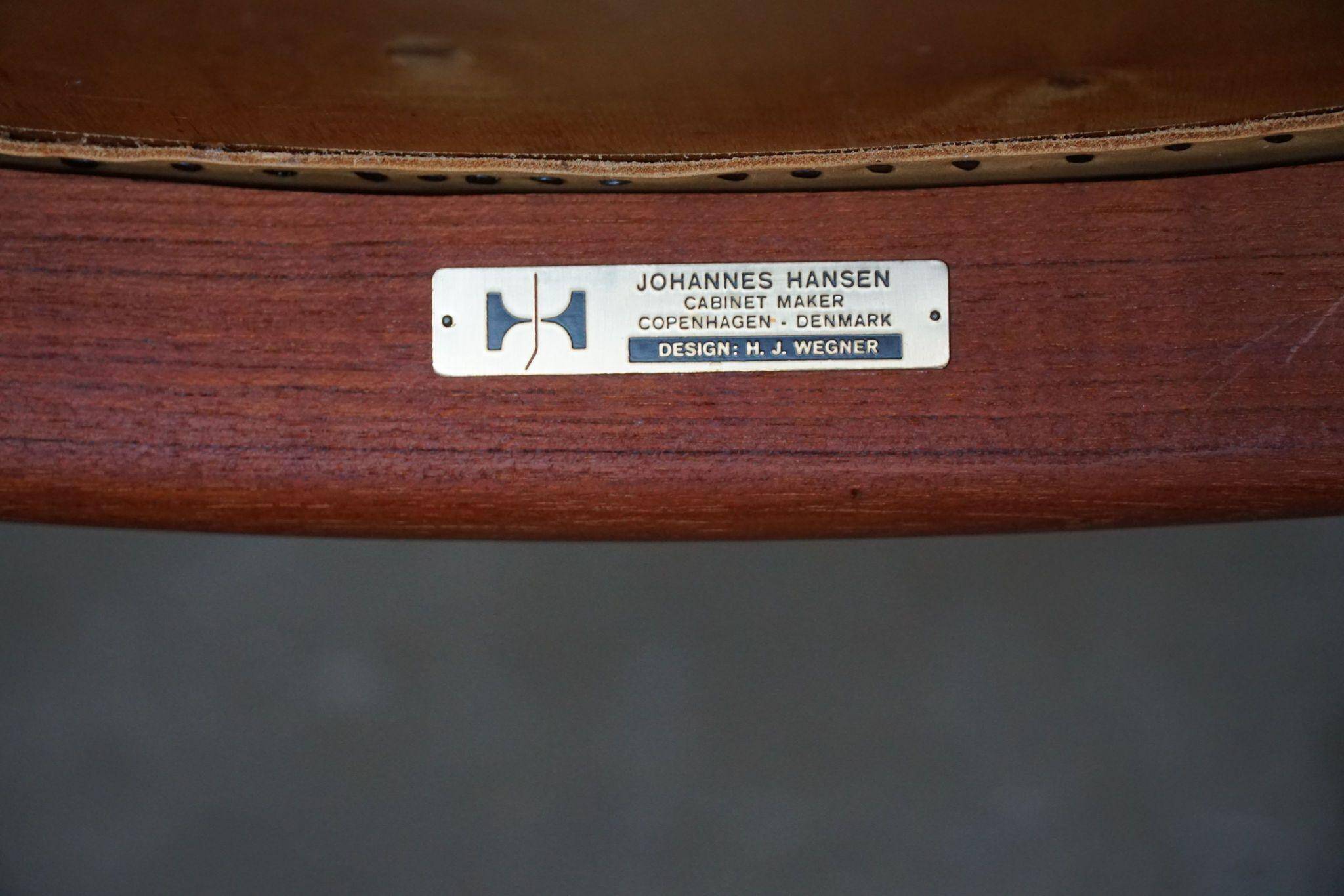 Hans J. Wegner, Teak and leather armchair, model "The Chair" JH501, 1950s