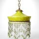 Antique Art Deco lampshade in yellow marbled glass with bead fringes.
