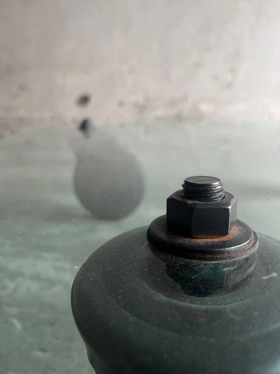 Gae Aulenti coffee table for Fontana Arte, transparent glass top with black cast iron supports, 1980s.