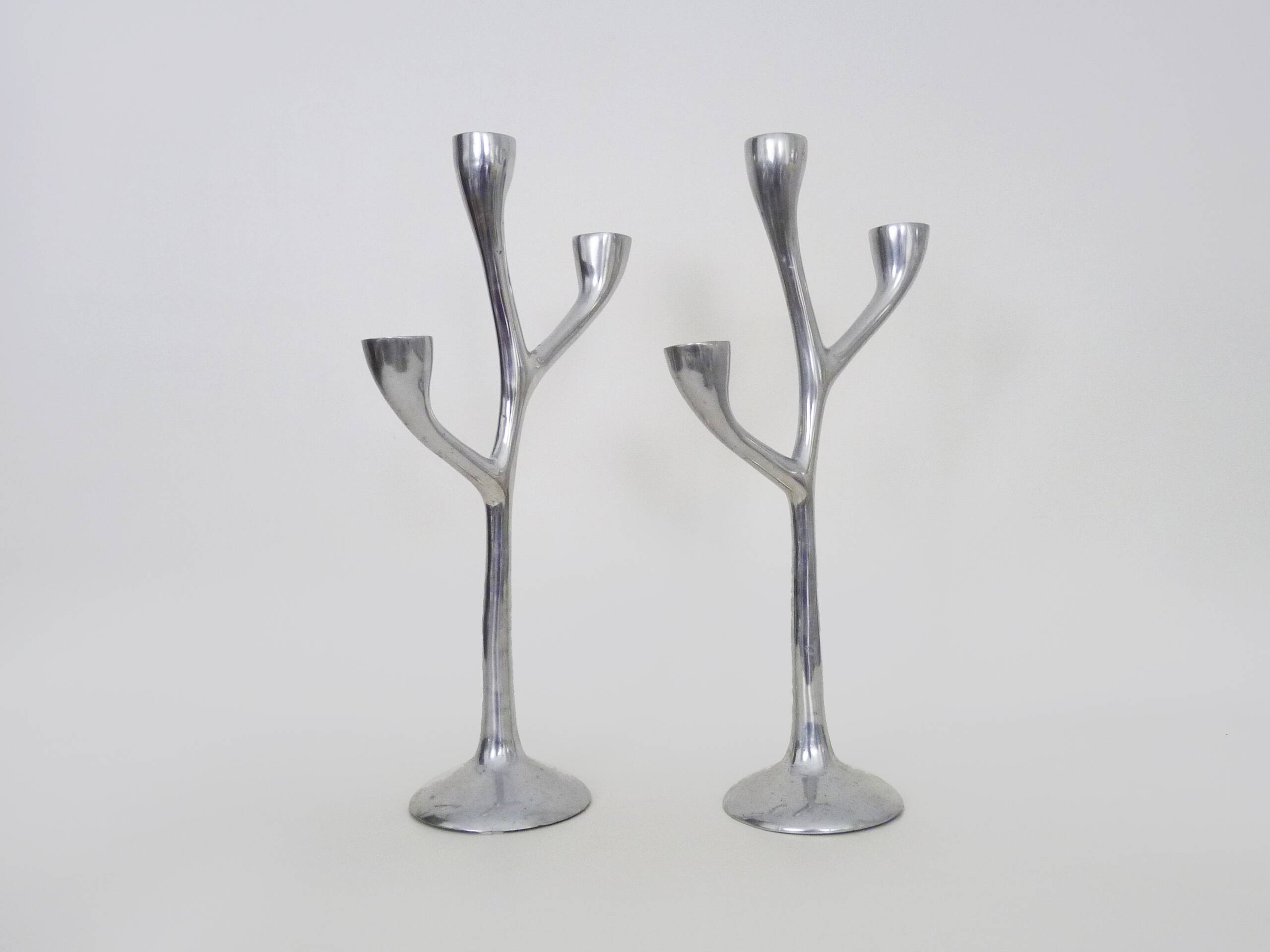 Pair of Italian "Tree" candlesticks in cast aluminum from the 80s