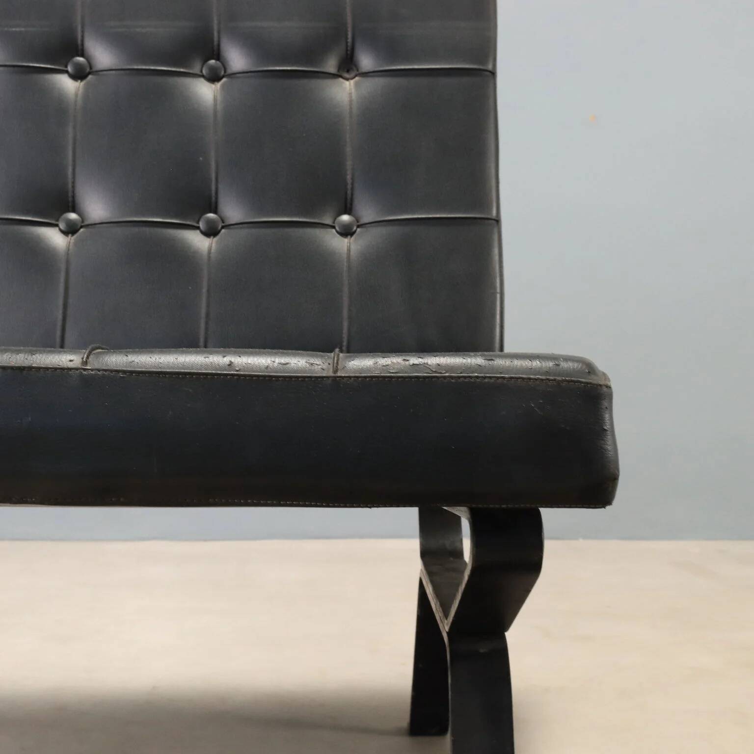 Vintage armchair in metal and black faux leather, Italian design from the 1970s.