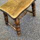 Small vintage low stool made of turned solid wood footrest 1960