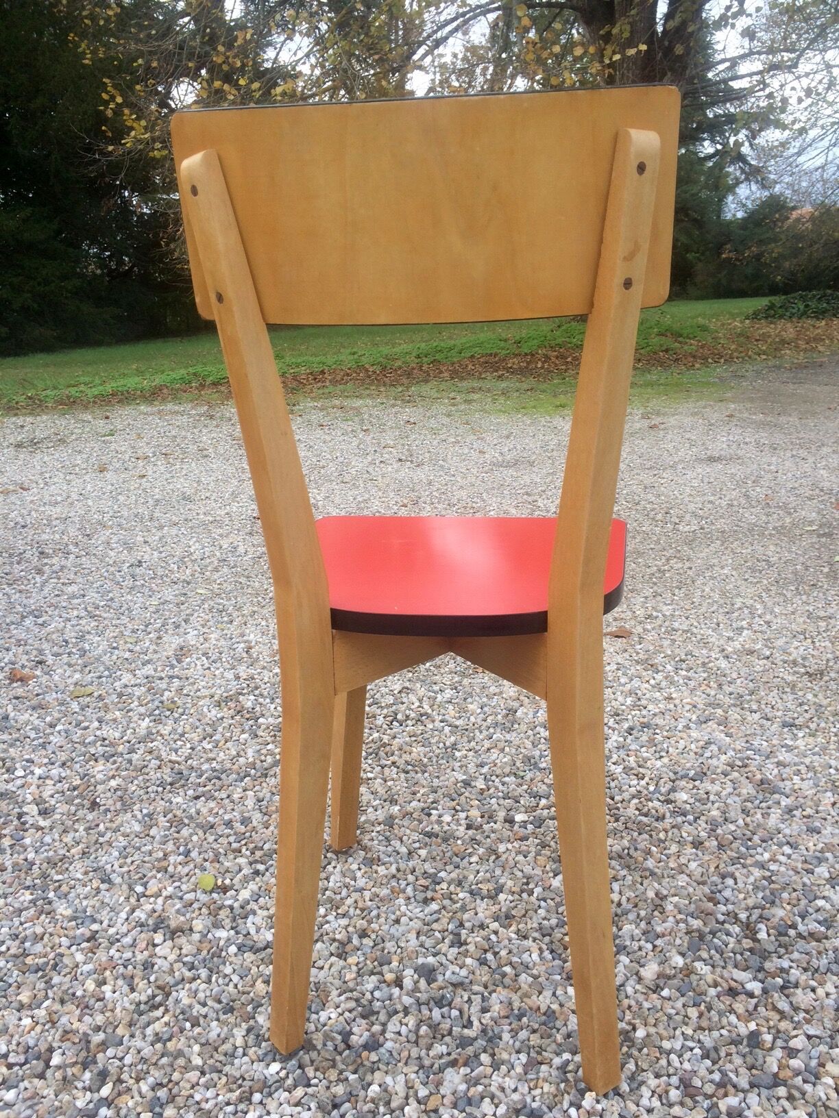 Eight wooden and formica chairs