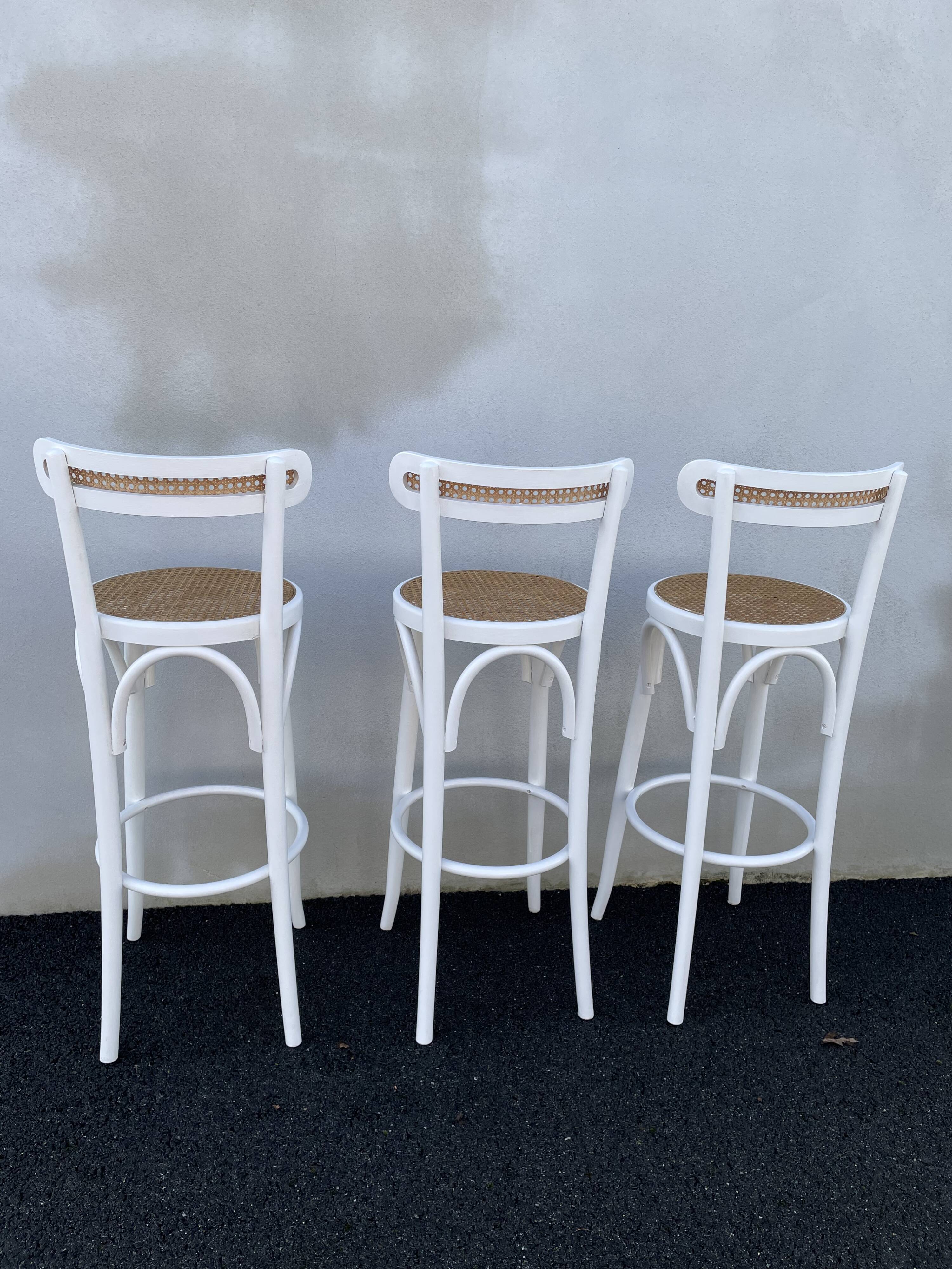 High stools in cane and curved wood 1970-1980