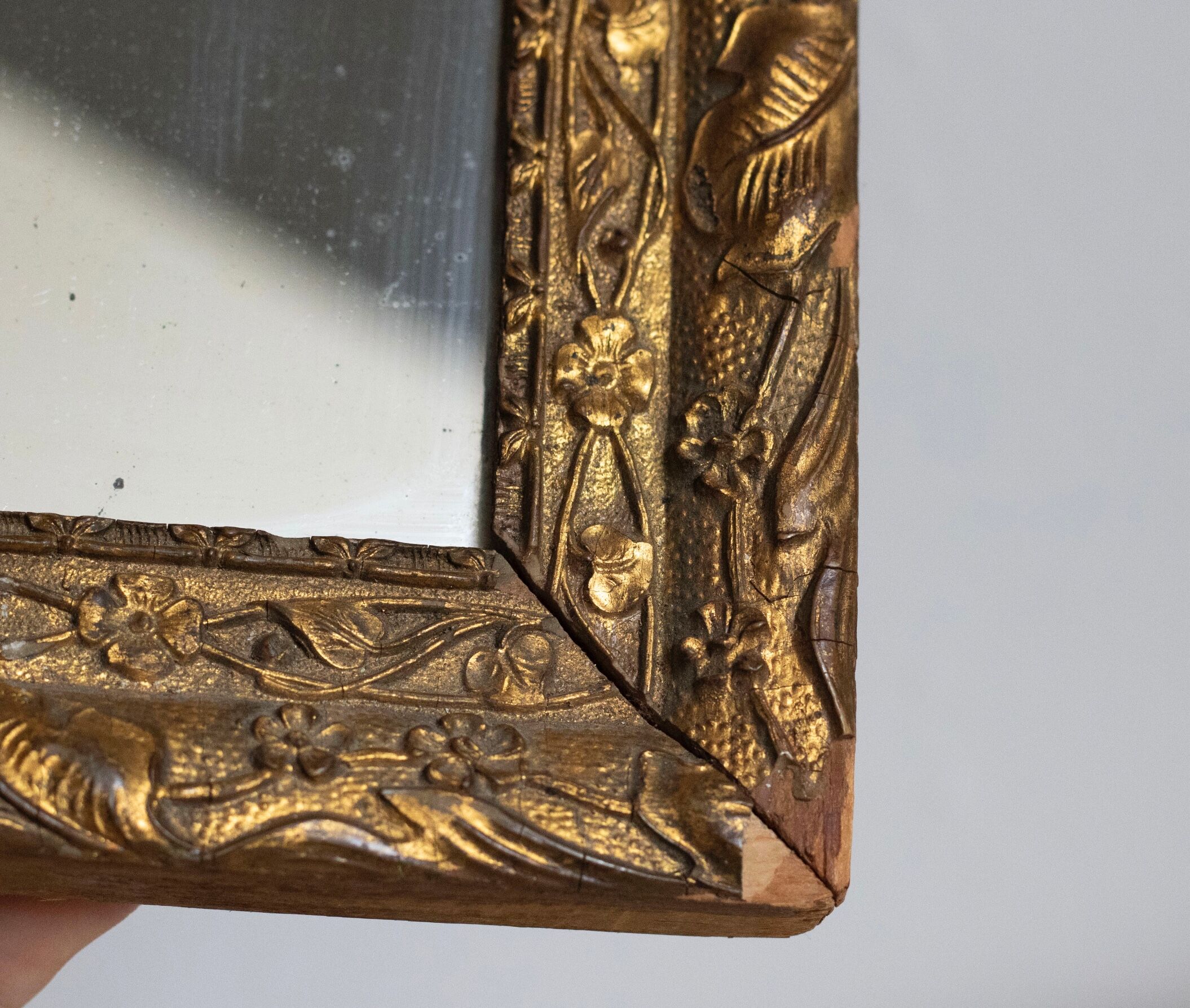 Antique mirror in gilded wood