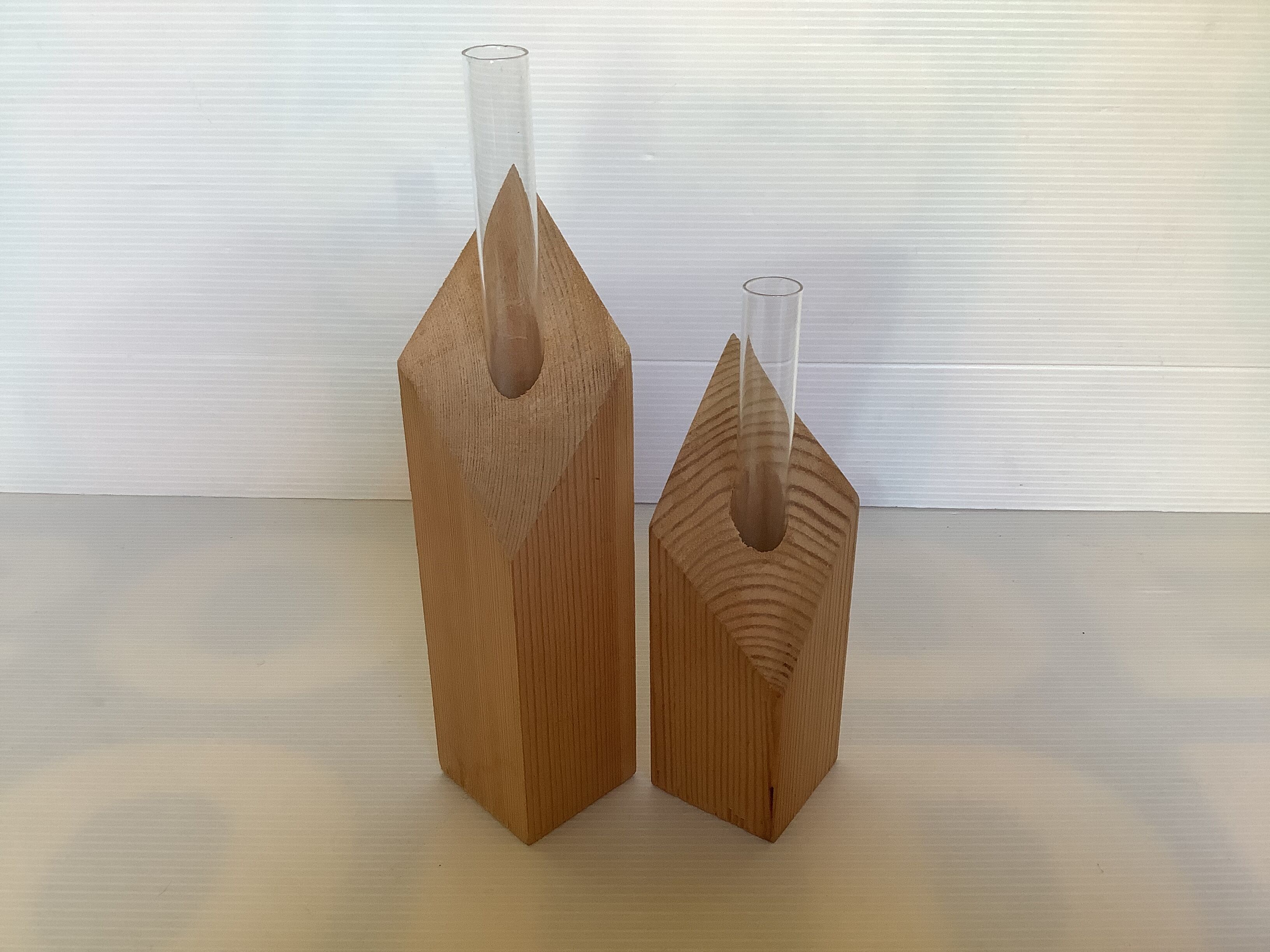 Pair of diamond-shaped wooden Scandinavian test tube vases.