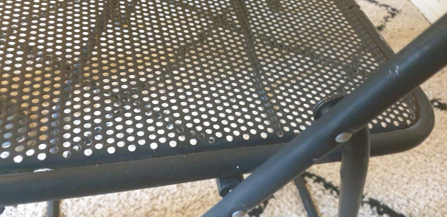 Pair of folding chairs in perforated metal