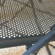 Pair of folding chairs in perforated metal