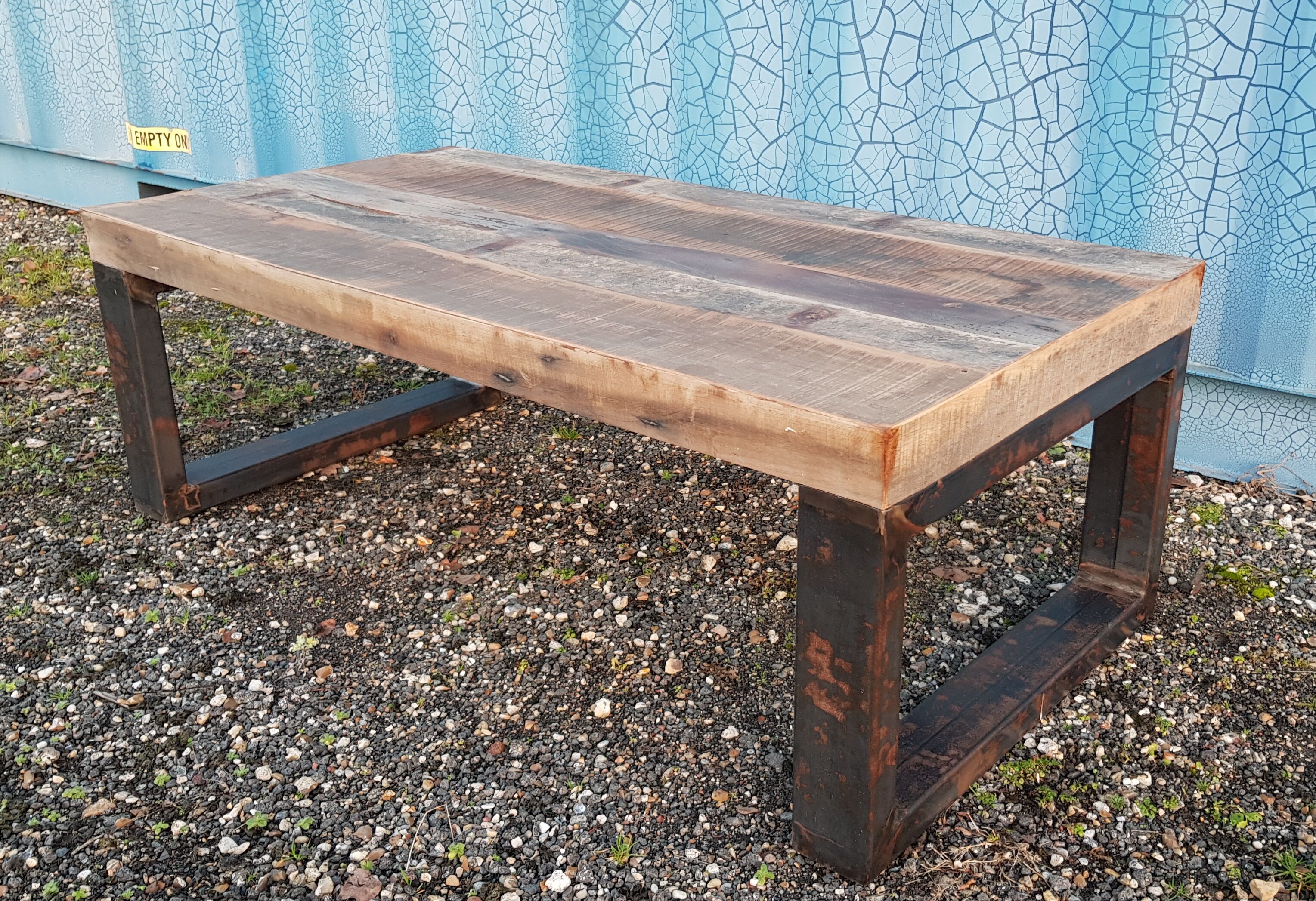Industrial coffee table with wooden top and metal legs