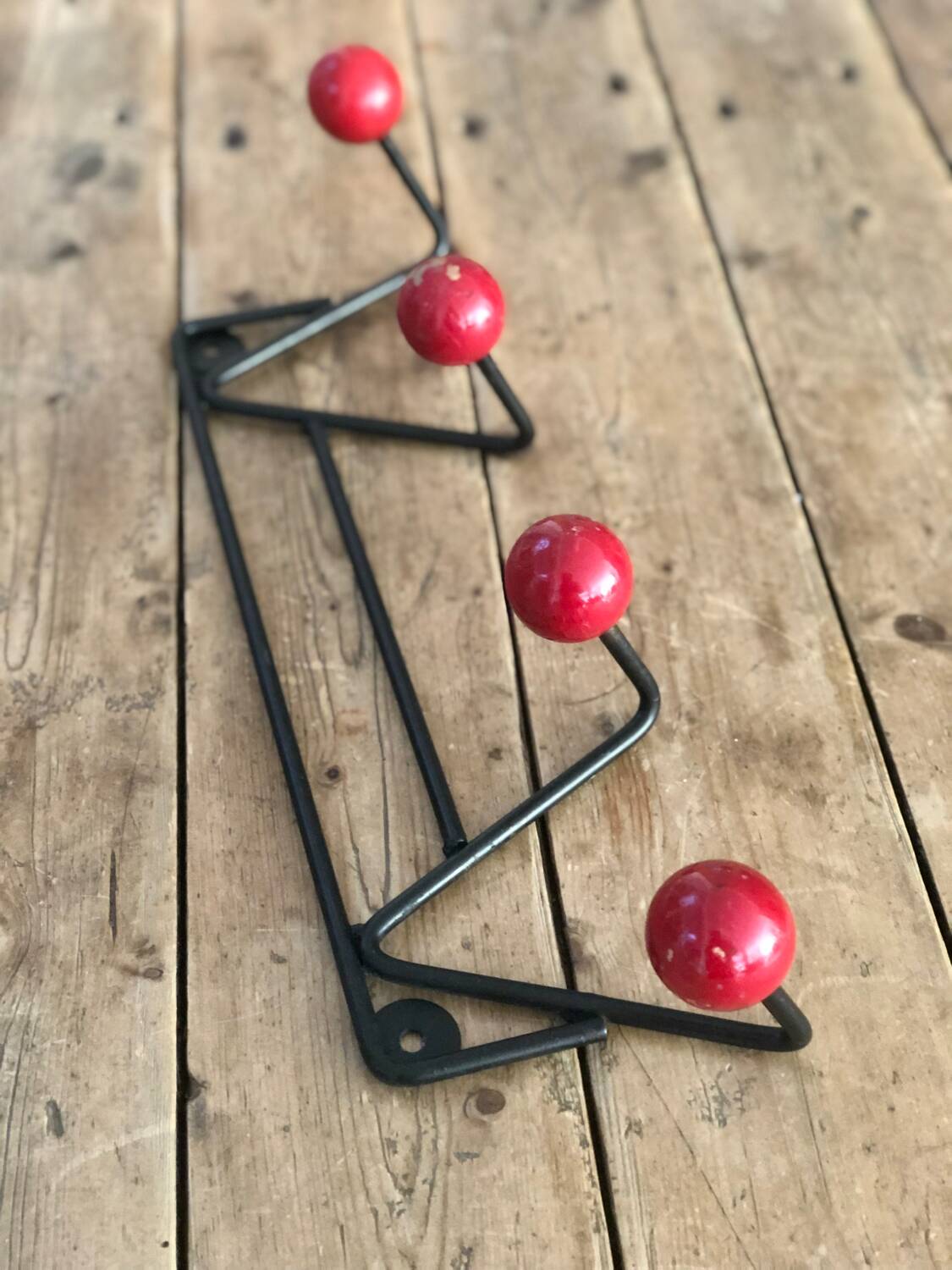 Red and black coat rack