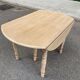 Round dining table with extendable leaves, Louis Philippe style, stripped in raw oak.
