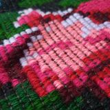 Handwoven floral wool rug, black background with pink roses and geometric design 207x144cm