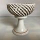 Braided ceramic ring pocket emptier