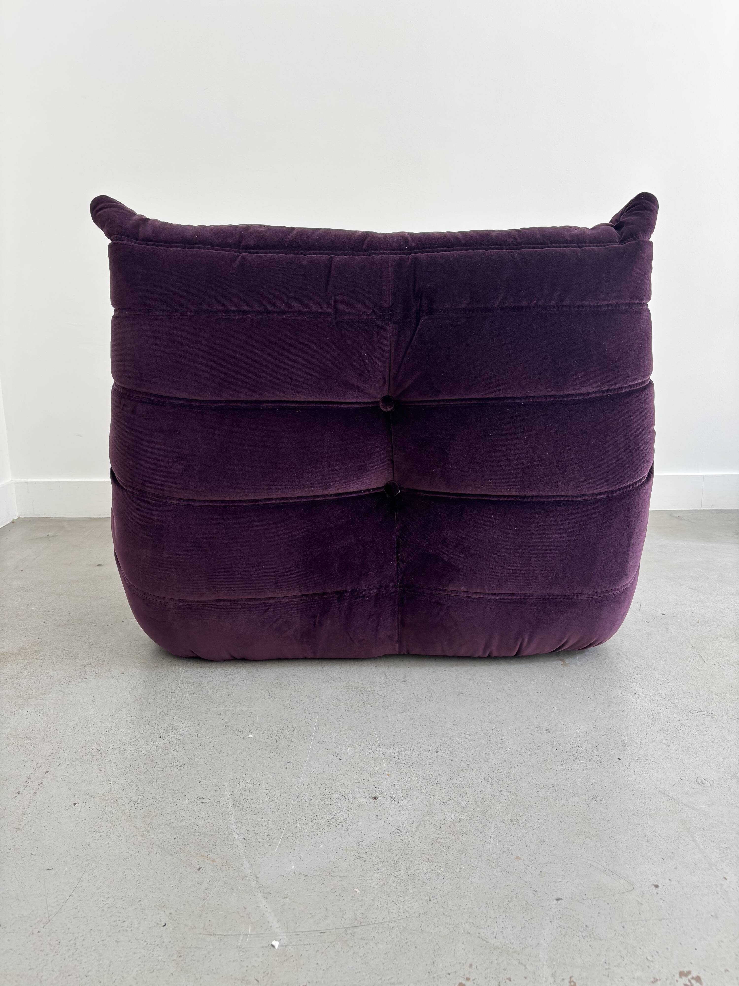 Purple "Togo" armchair by Michel Ducaroy