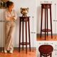 Antique high wooden pedestal with mahogany patina, circa 1900-1925.