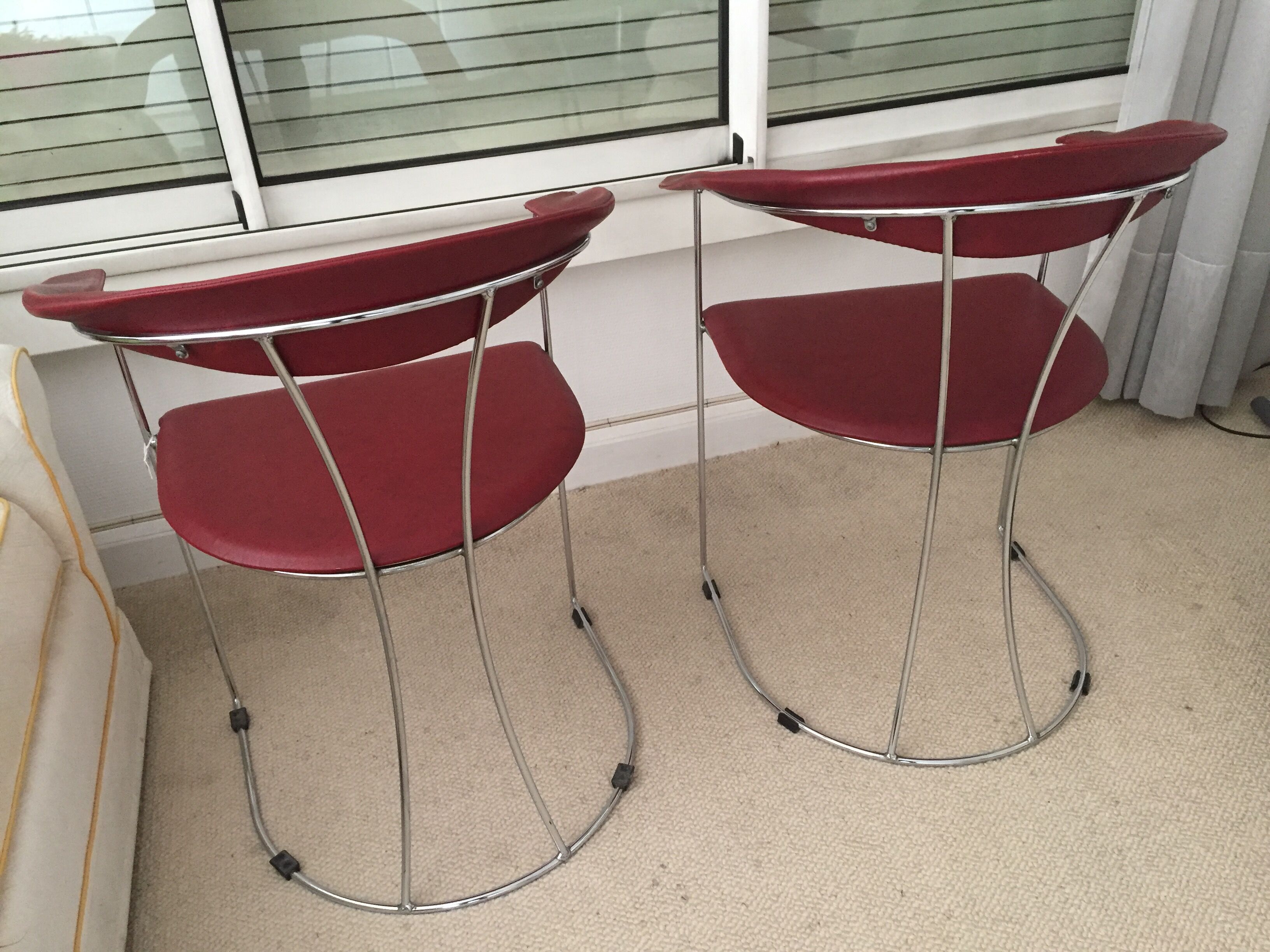 Pair of red chairs in 80s skai