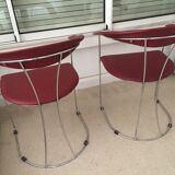 Pair of red chairs in 80s skai