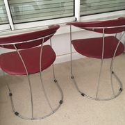 Pair of red chairs in 80s skai