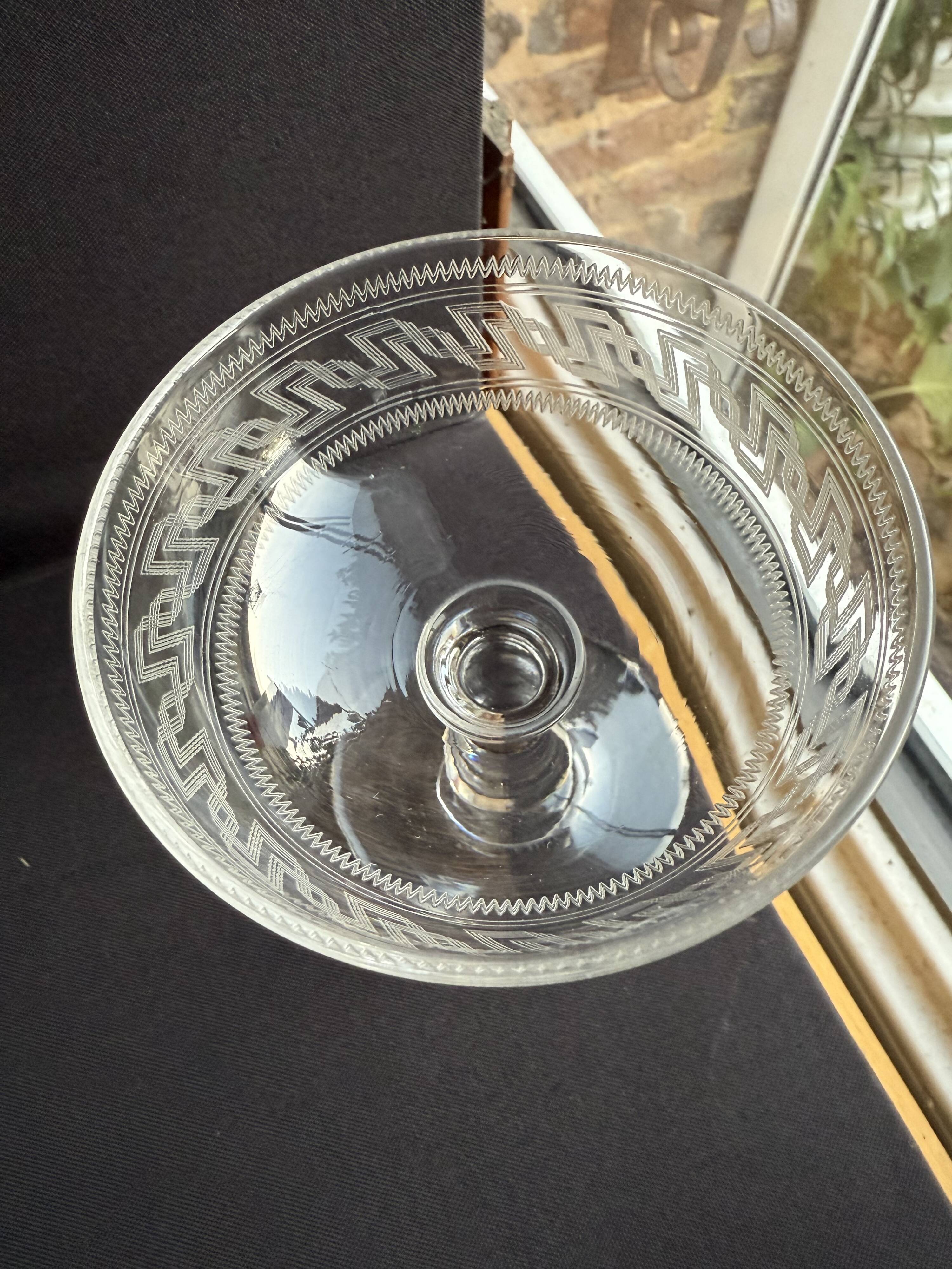 6 Baccarat champagne coupes with Greek engraving, slanted.