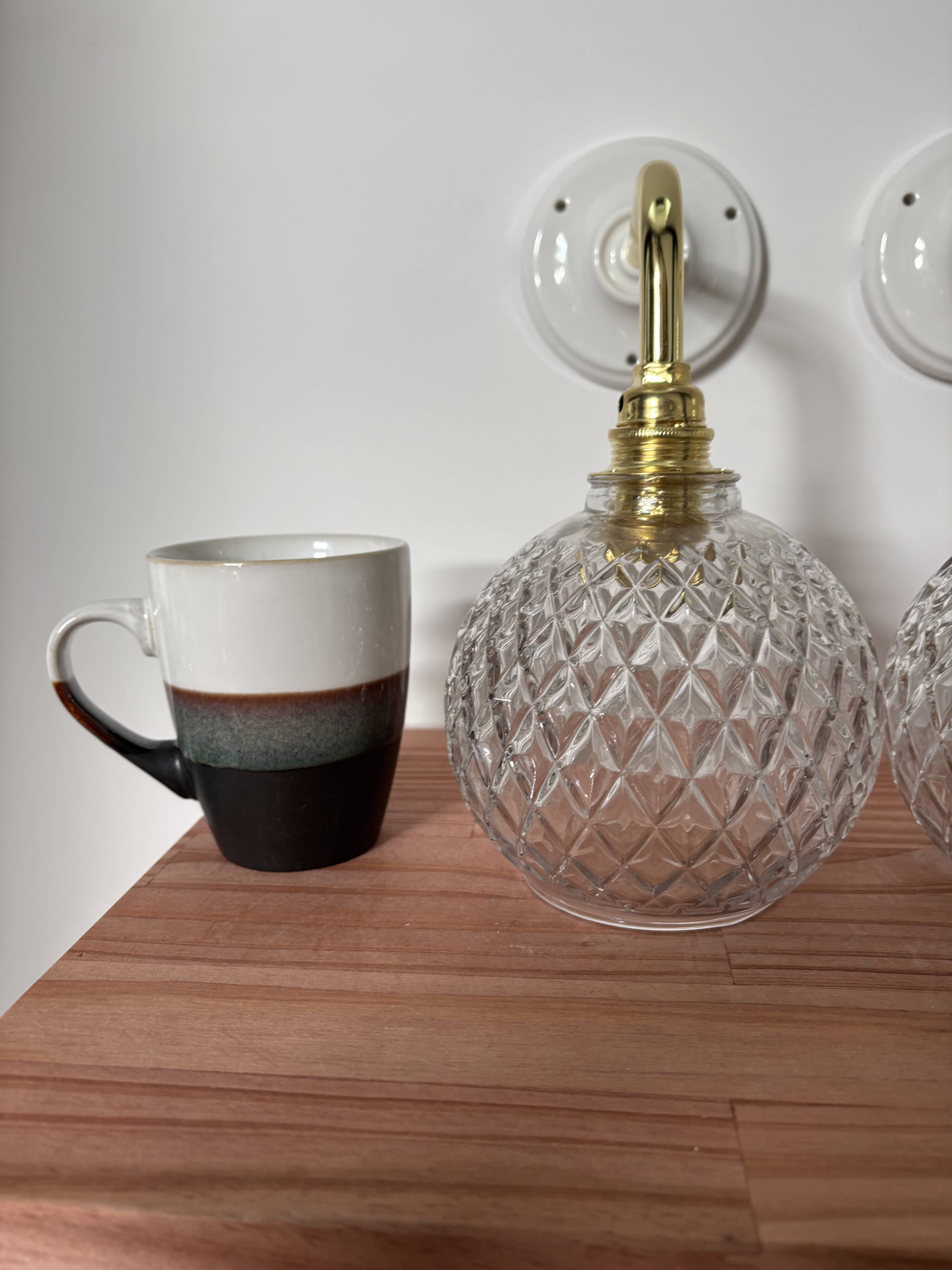 Pair of chiseled glass globe wall sconces