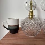 Pair of chiseled glass globe wall sconces