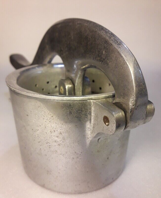 Vintage grapefruit metal citrus press