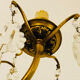 Brass wall light with glass pendants from the mid-20th century.