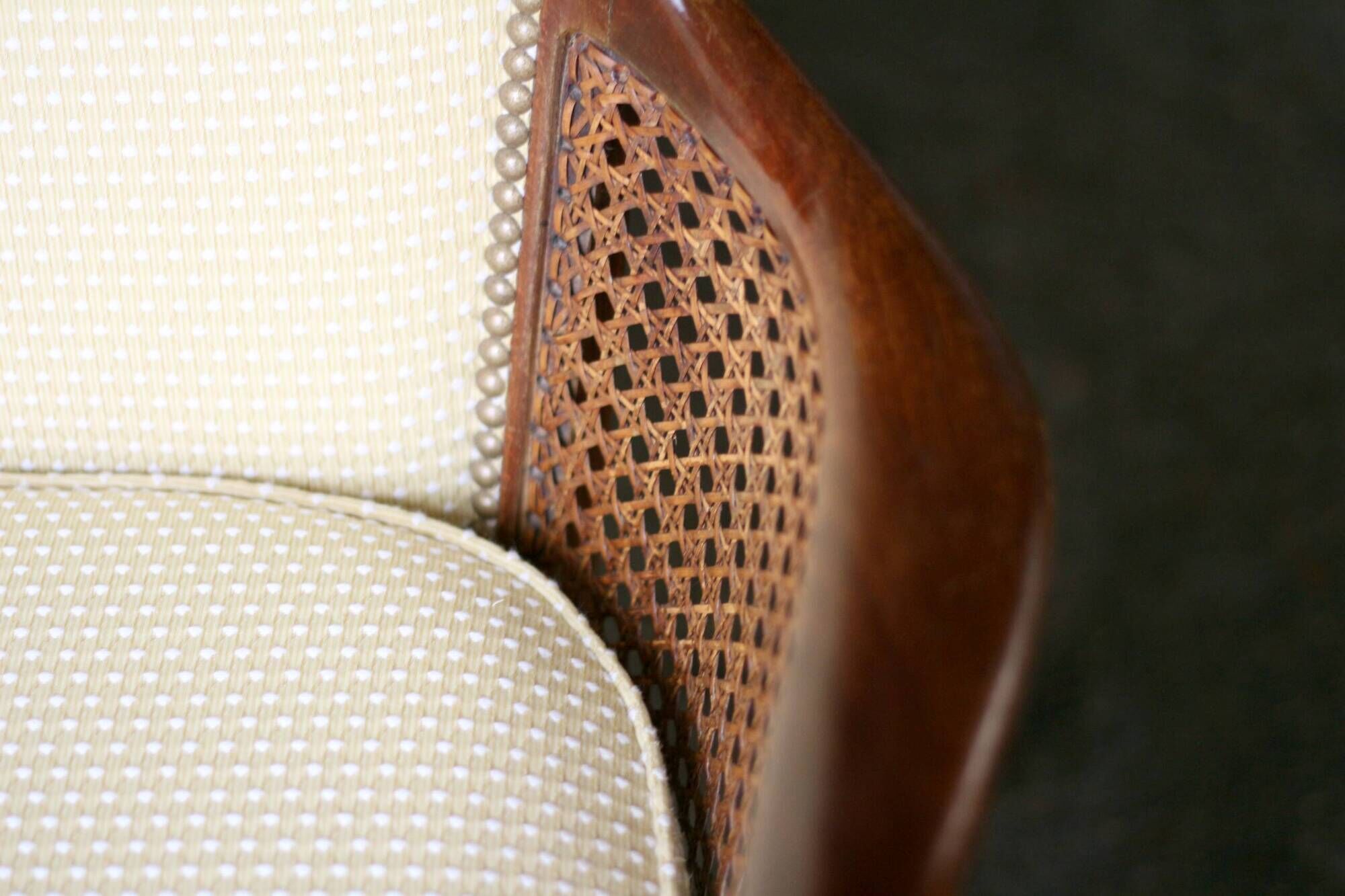 pair of mahogany and cane armchairs. English work (1960s).
