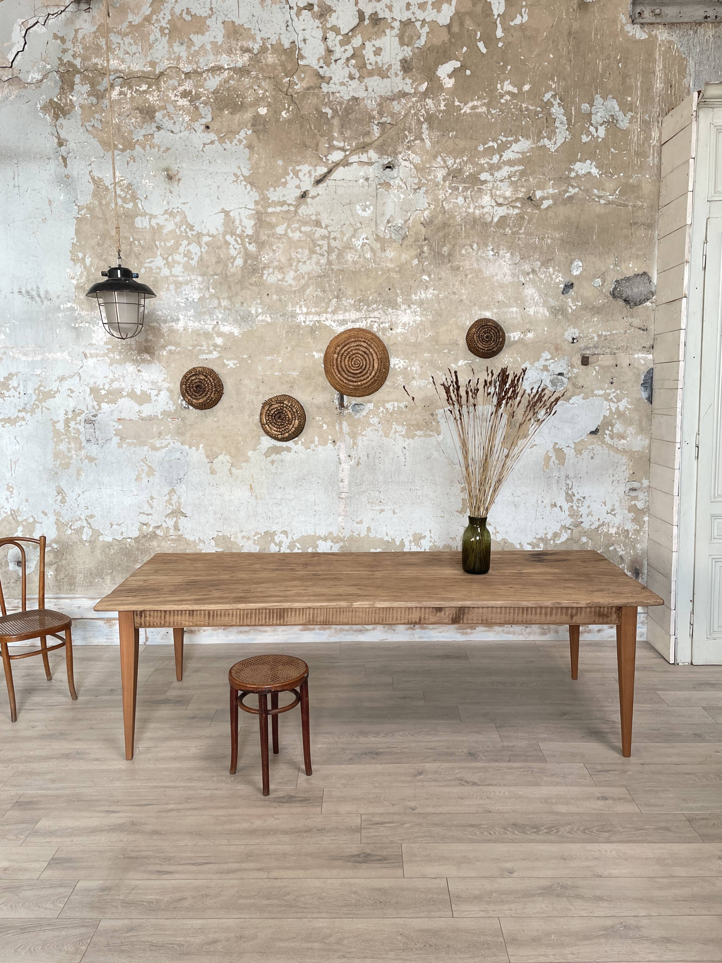 Vintage farm table with spindle legs.