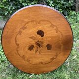Pedestal table with inlaid top and flower decoration