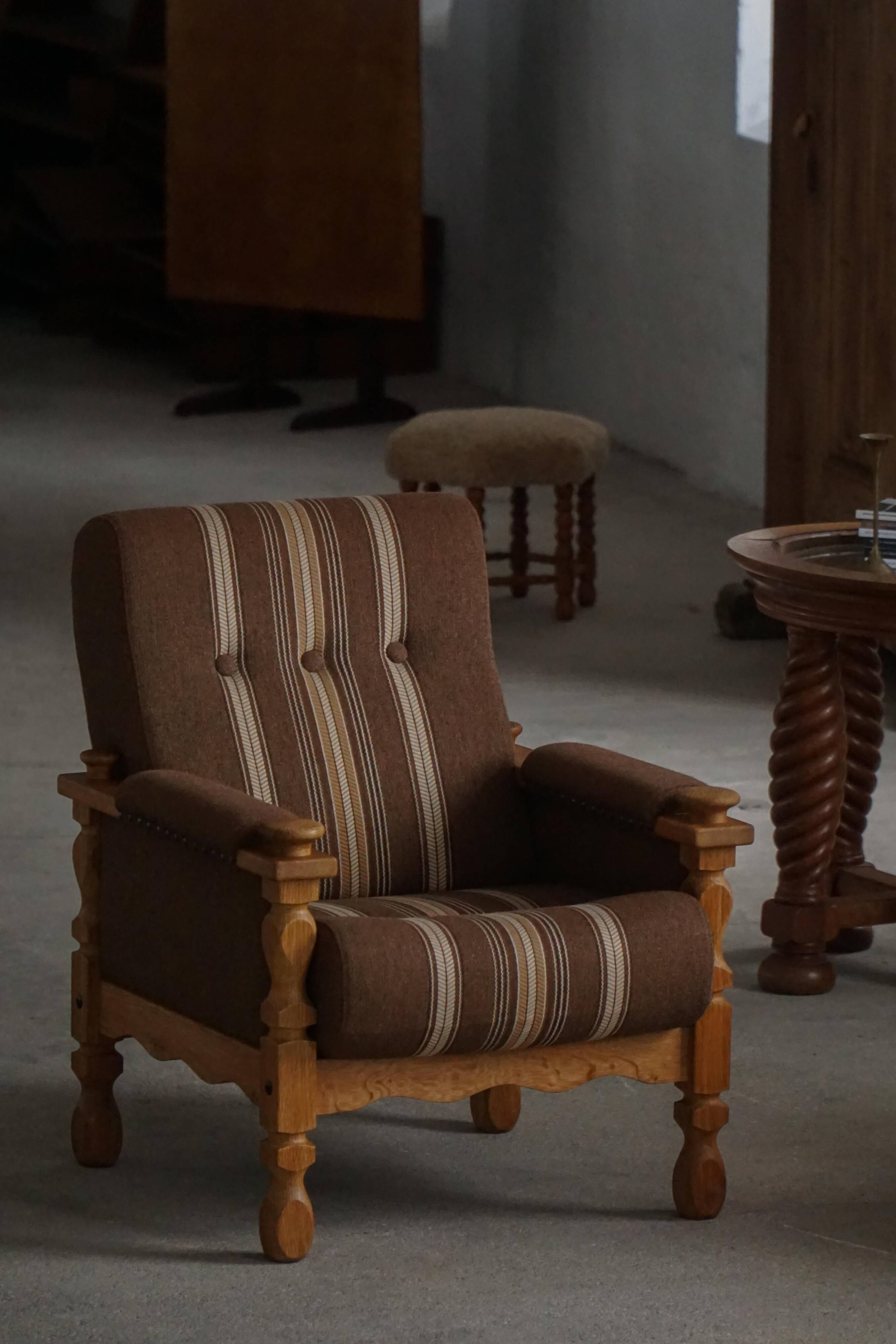 Modern Danish, a pair of lounge chairs in oak and wool, Henning Kjærnulf, 1960s.