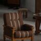 Modern Danish, a pair of lounge chairs in oak and wool, Henning Kjærnulf, 1960s.