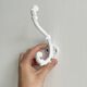 Bathroom décor, hooks, soap dish, white metal hangers.