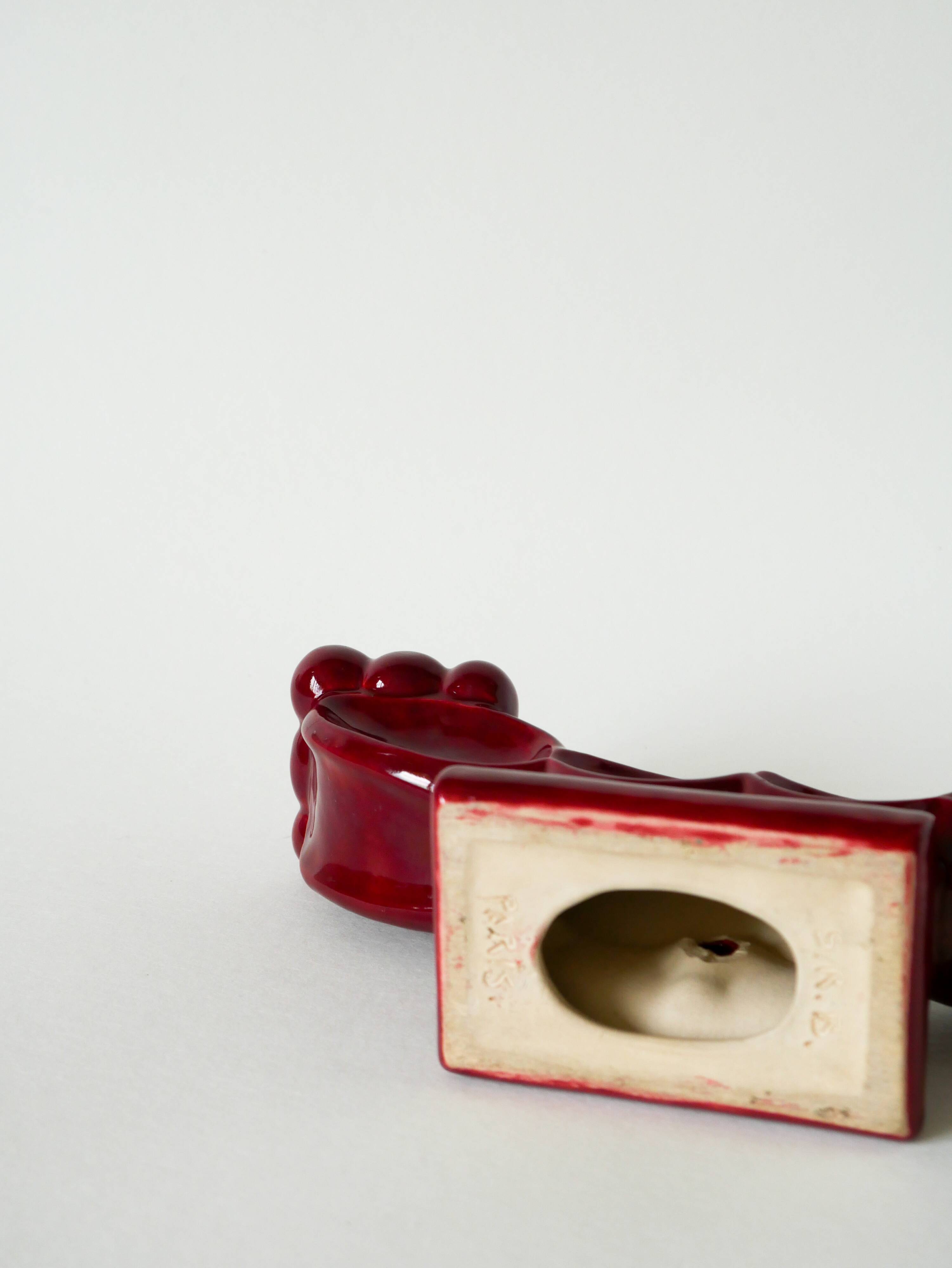 Pair of large burgundy ceramic candlesticks, 1950
