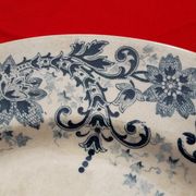 Plat à décor de frise bleu diam 28 cm