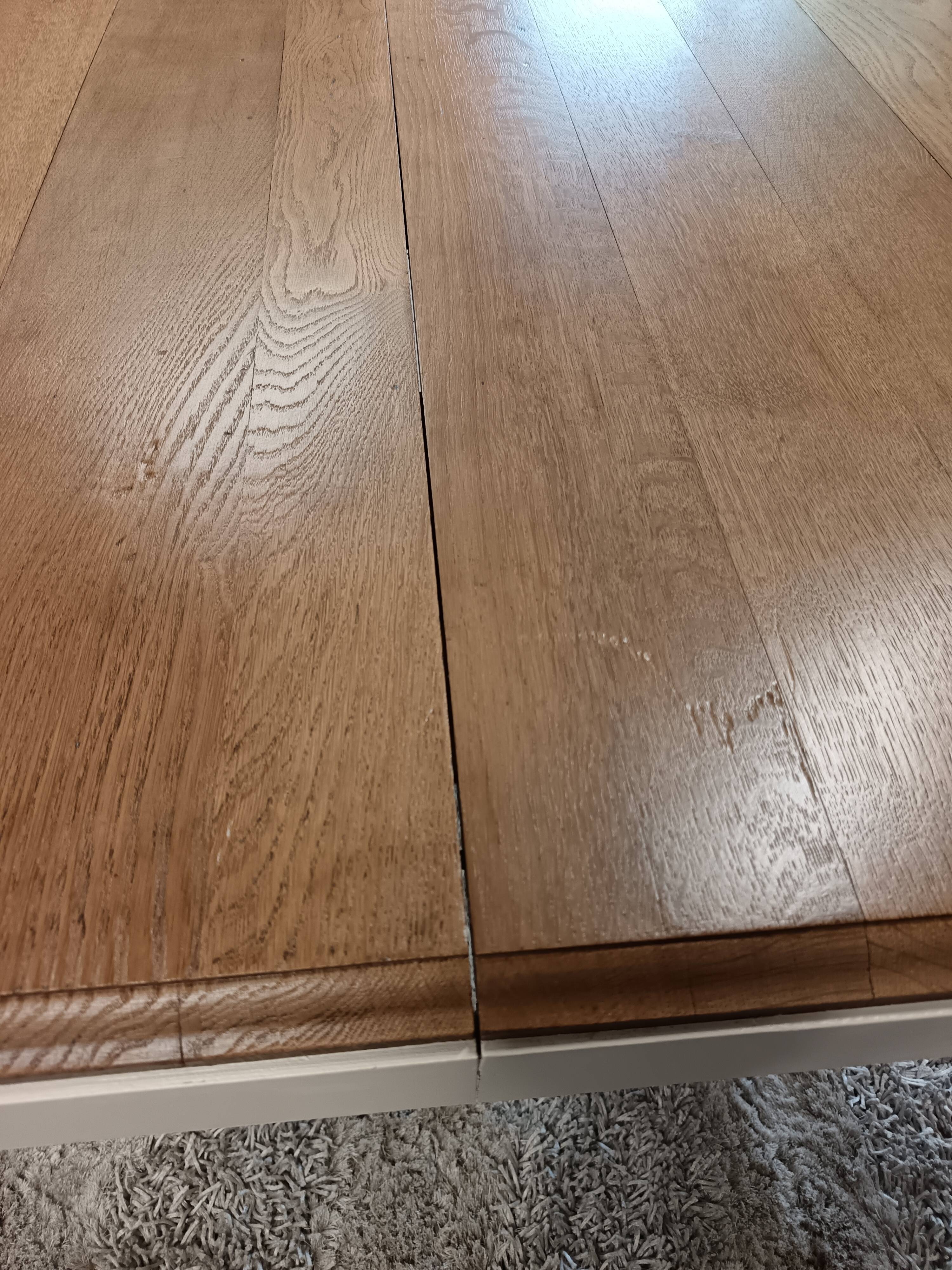 Restored oak table in natural wood and linen.
